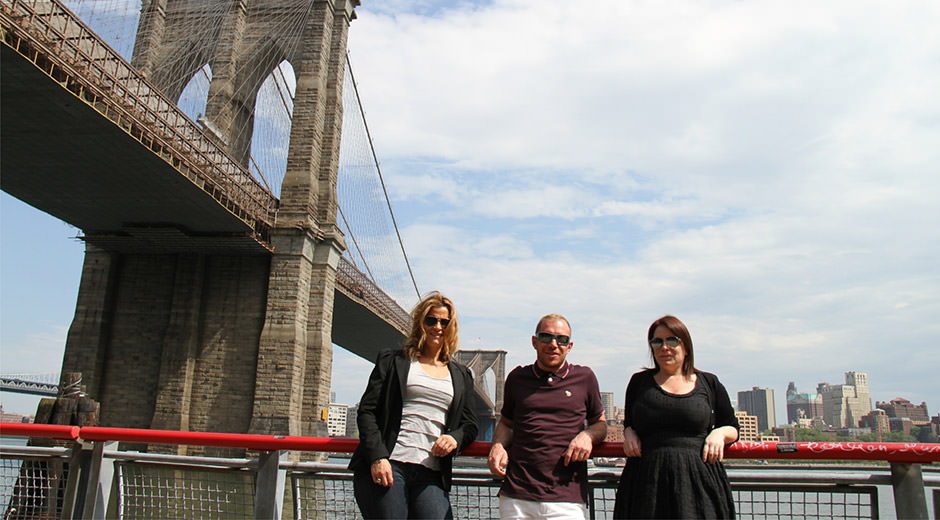 The Grand Visual New York team – Ben Putland, Jennifer Bolnick, and Rebecca Jean Louis – by the Brooklyn Bridge