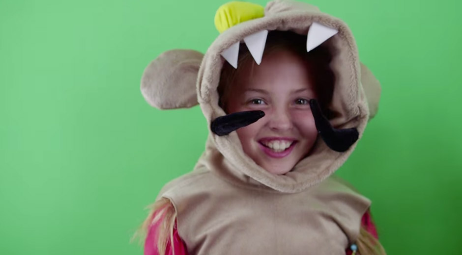 A child in a monster costume in front of the green screen at the Nokia Lumia 930 launch