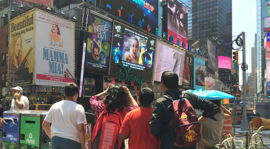 A photo of crowds enjoying the Times Square Disney Inside Out interactive activation